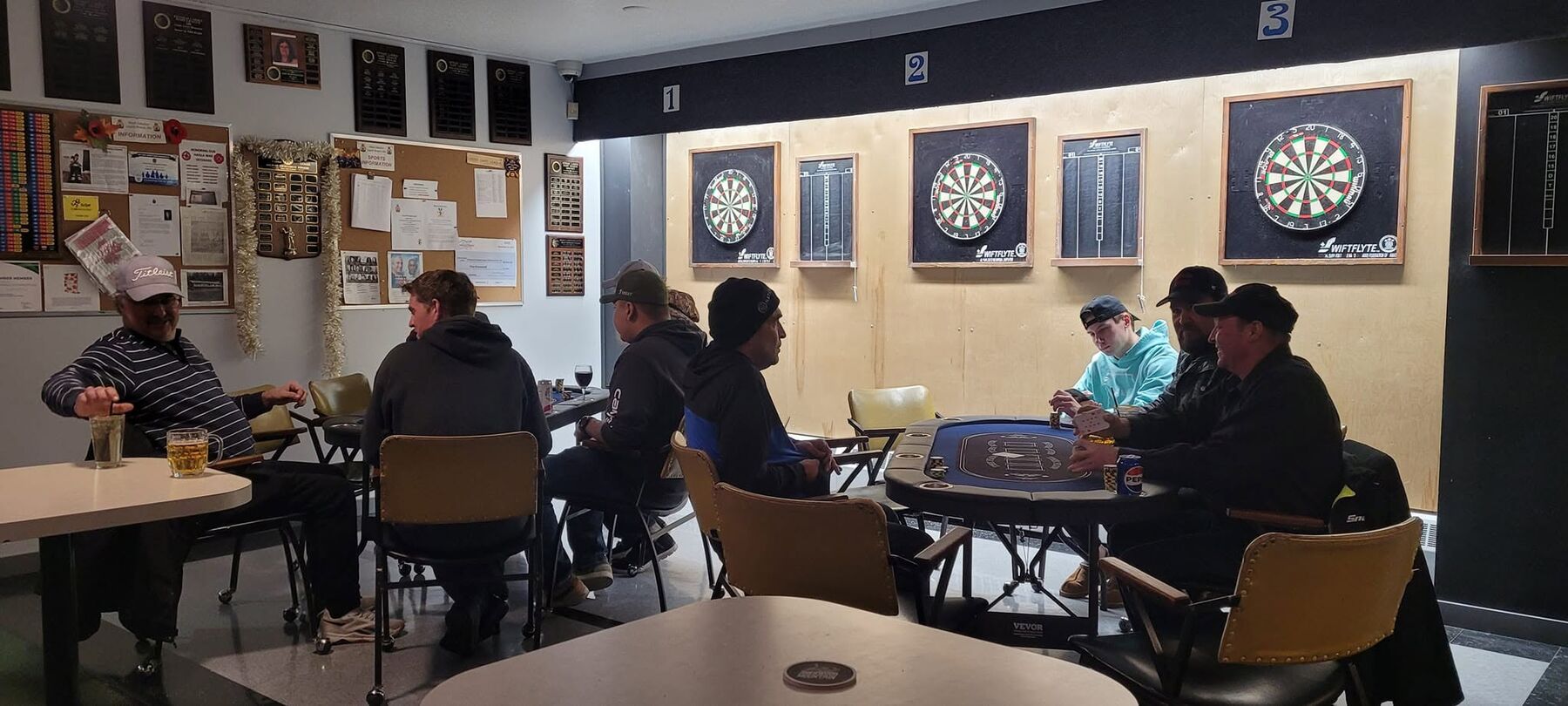 The games room with dartboards and a pool table