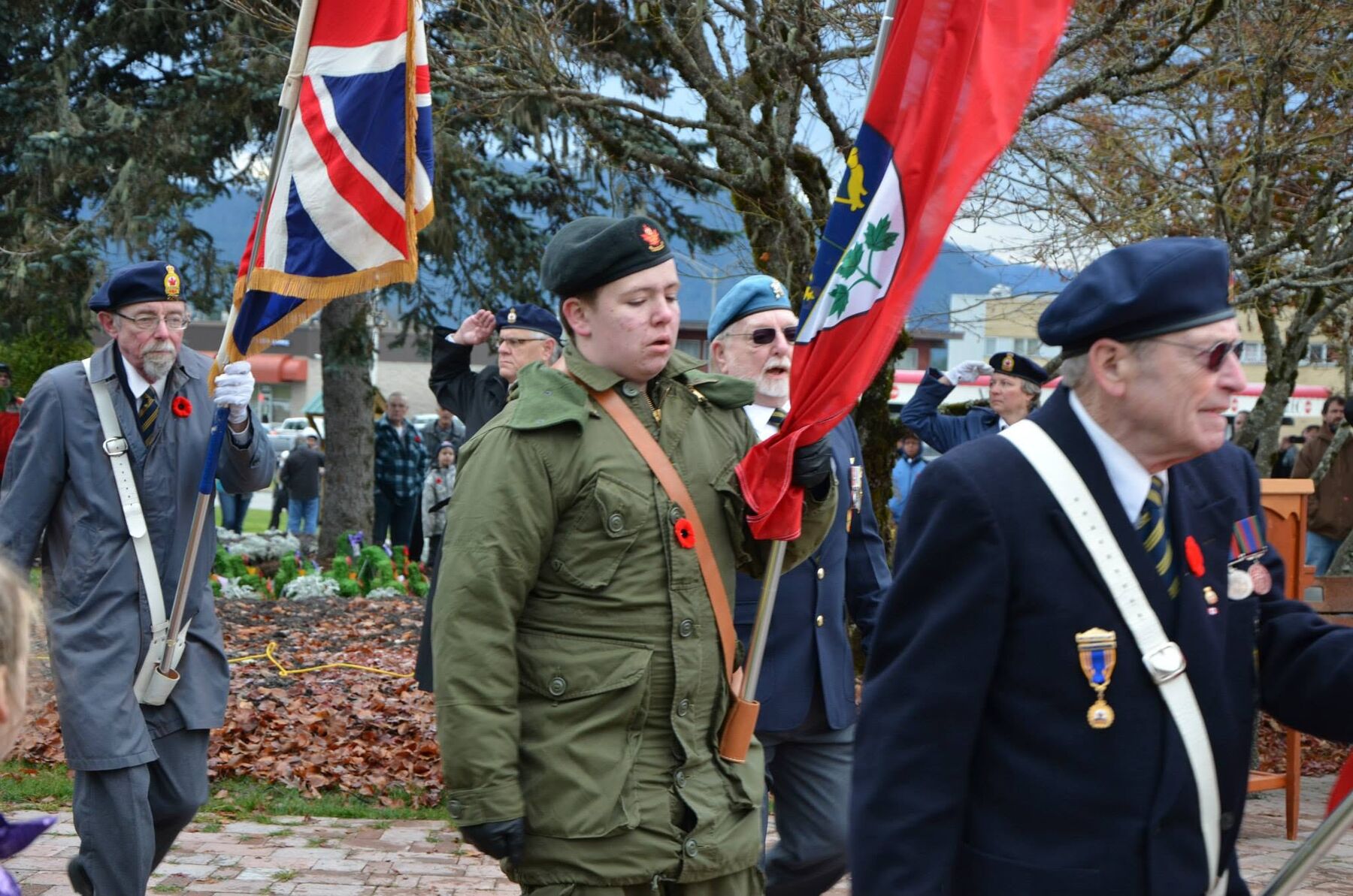 Veterans and cadets of the colour party march past the Kitimat cenotaph
